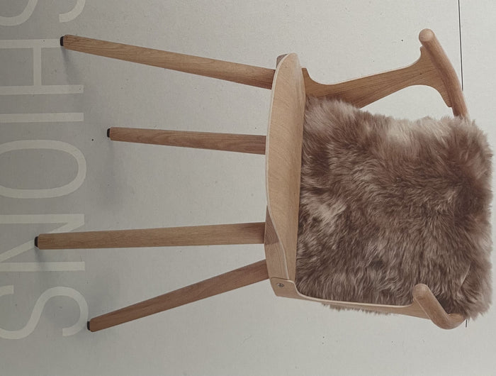 sheepskin cushion on a chair